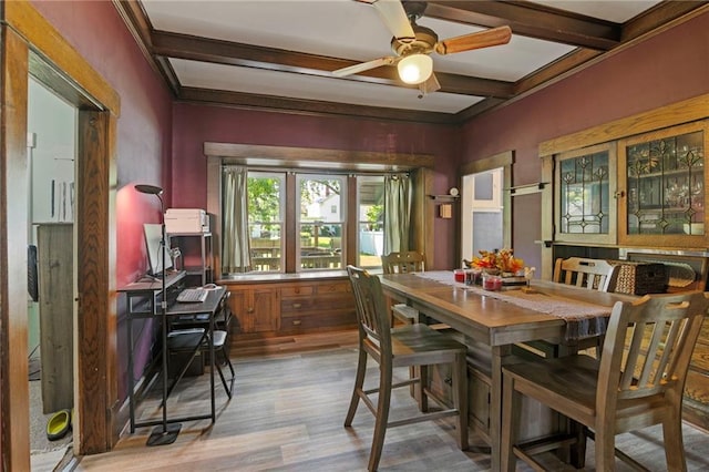 508 S Elm St, Ottawa, KS 66067 - dining space featuring beamed ceiling, light wood-type flooring, a ceiling fan, and ornamental molding