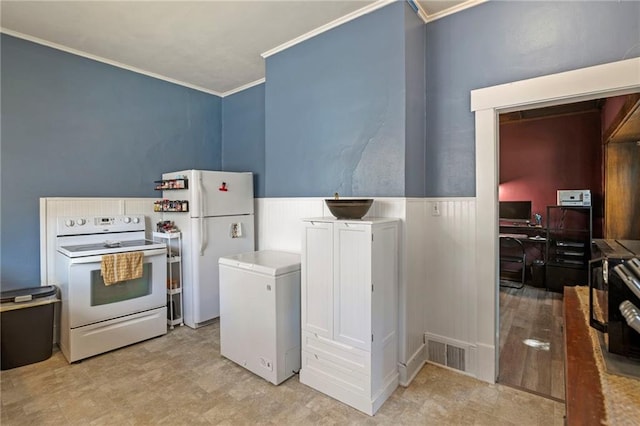 508 S Elm St, Ottawa, KS 66067 - kitchen featuring white appliances, crown molding, wainscoting, and an office area