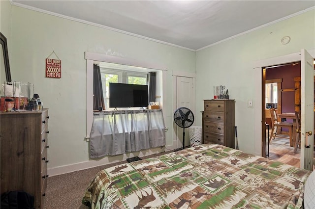 508 S Elm St, Ottawa, KS 66067 - bedroom featuring ornamental molding and carpet