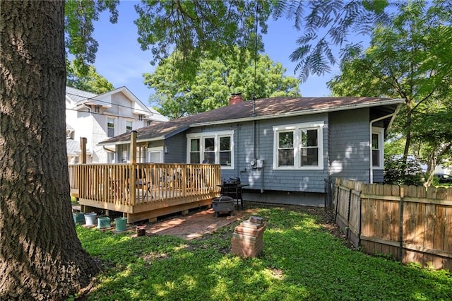508 S Elm St, Ottawa, KS 66067 - rear view of house featuring a deck and a chimney
