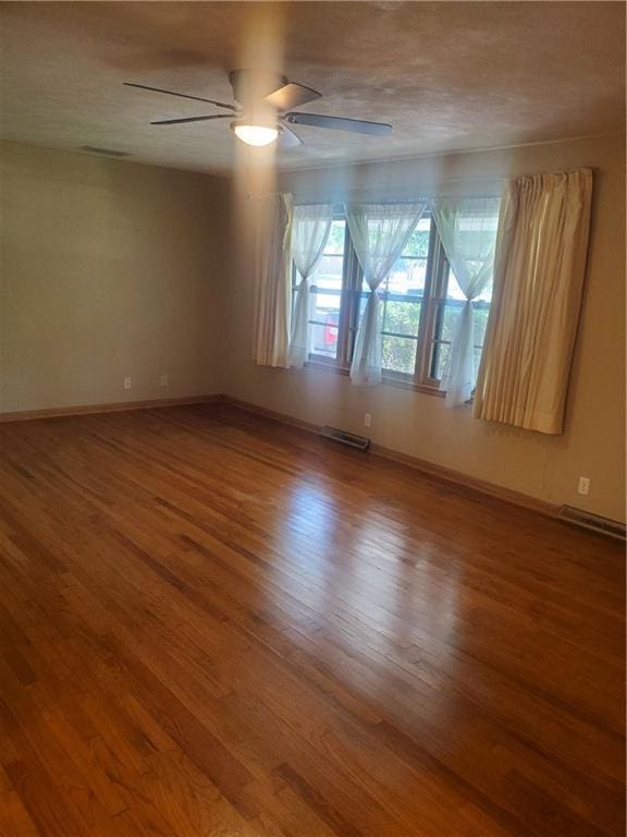 304 Swan St, Lacygne, KS 66040 - spare room with wood finished floors and ceiling fan