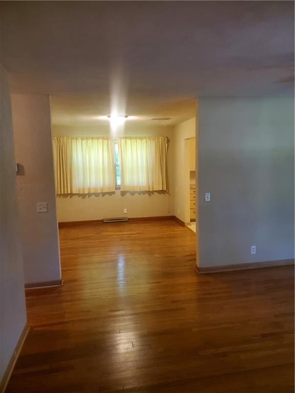 304 Swan St, Lacygne, KS 66040 - unfurnished room featuring baseboards and wood finished floors