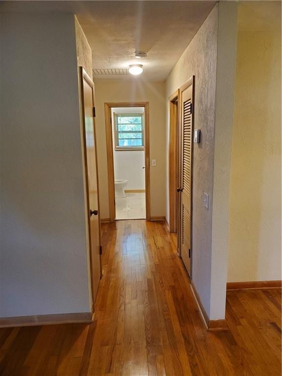 304 Swan St, Lacygne, KS 66040 - hall with wood finished floors and a textured wall