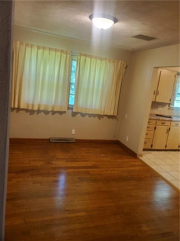 304 Swan St, Lacygne, KS 66040 - unfurnished room featuring light wood-style floors and baseboards