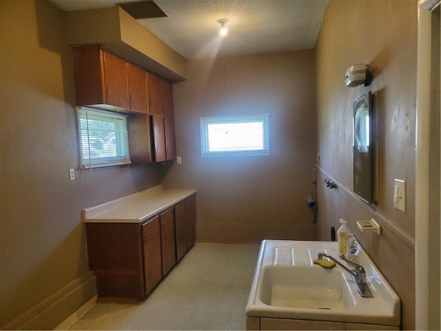 304 Swan St, Lacygne, KS 66040 - kitchen with brown cabinetry and light countertops