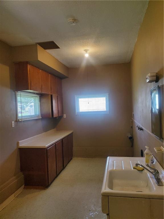 304 Swan St, Lacygne, KS 66040 - kitchen featuring brown cabinets and light countertops