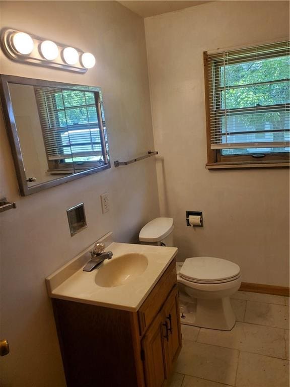 304 Swan St, Lacygne, KS 66040 - bathroom featuring vanity, healthy amount of natural light, and tile patterned flooring
