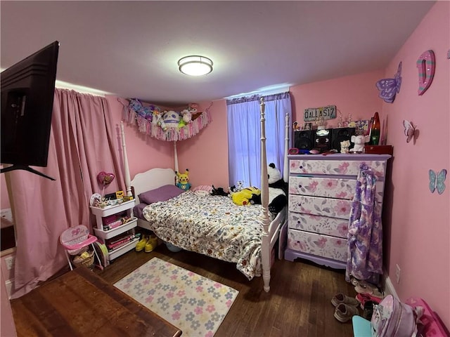 310 W 23rd St, Higginsville, MO 64037 - bedroom featuring wood finished floors