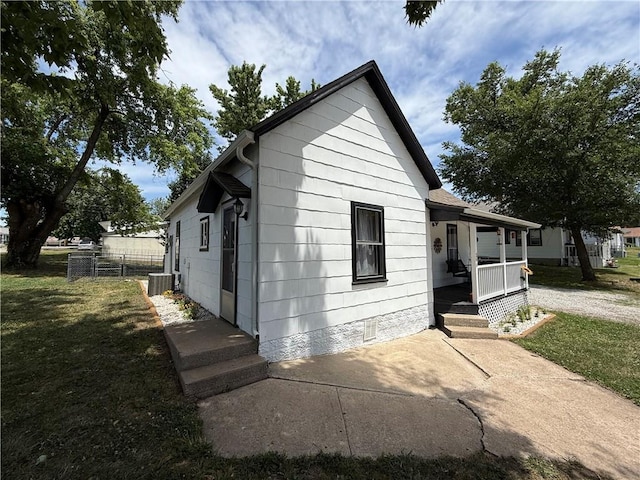 310 W 23rd St, Higginsville, MO 64037 - view of home's exterior with covered porch and crawl space