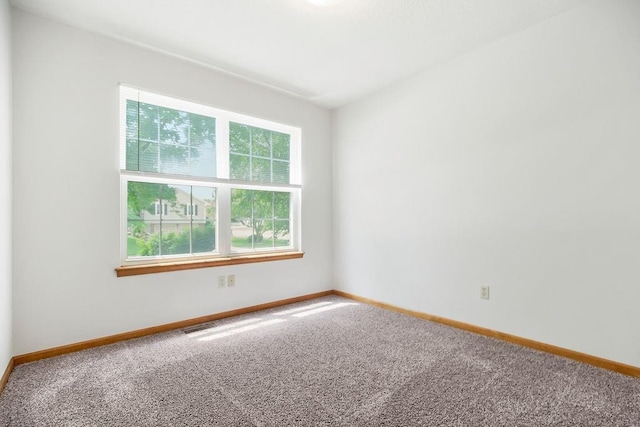 733 NE Colleen Dr, Lees Summit, MO 64086 - carpeted empty room featuring baseboards