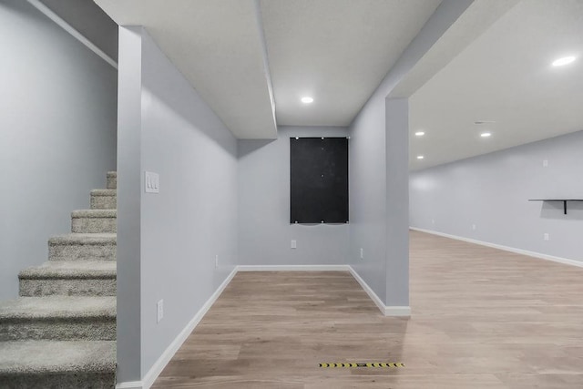 733 NE Colleen Dr, Lees Summit, MO 64086 - finished below grade area featuring wood finished floors, stairs, and recessed lighting