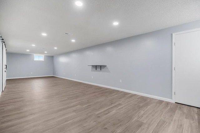 733 NE Colleen Dr, Lees Summit, MO 64086 - basement featuring recessed lighting and light wood-style flooring