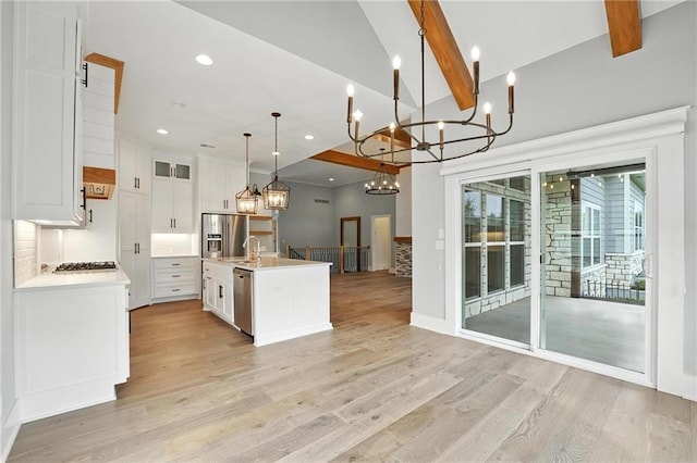 13300 W 174th Pl, Overland Park, KS 66221 - kitchen with stainless steel appliances, open floor plan, light wood-style flooring, a chandelier, and recessed lighting