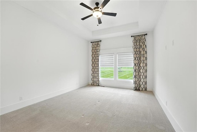 13300 W 174th Pl, Overland Park, KS 66221 - spare room featuring carpet, a raised ceiling, and ceiling fan