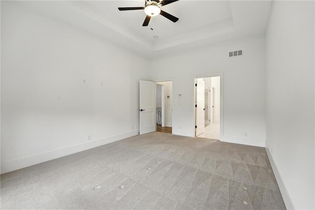 13300 W 174th Pl, Overland Park, KS 66221 - spare room featuring ceiling fan, light carpet, and a raised ceiling
