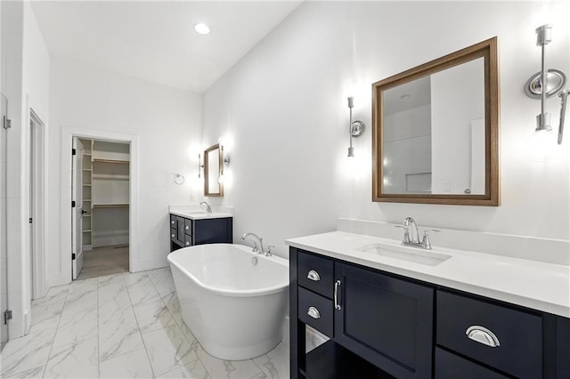 13300 W 174th Pl, Overland Park, KS 66221 - full bathroom with two vanities, marble look tiles, a soaking tub, and a spacious closet