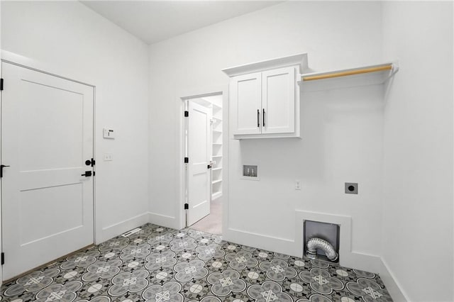 13300 W 174th Pl, Overland Park, KS 66221 - laundry area featuring electric dryer hookup, cabinet space, tile patterned floors, and hookup for a washing machine
