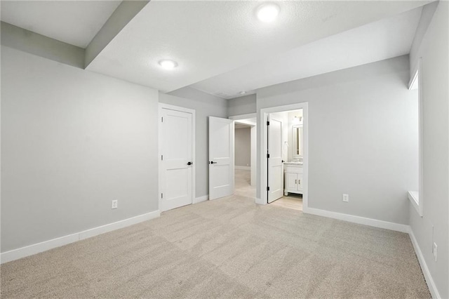 13300 W 174th Pl, Overland Park, KS 66221 - unfurnished bedroom with light colored carpet, connected bathroom, and recessed lighting