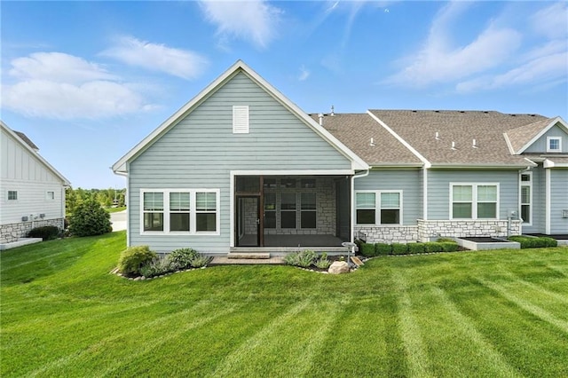 13300 W 174th Pl, Overland Park, KS 66221 - rear view of property featuring a sunroom, a yard, and stone siding