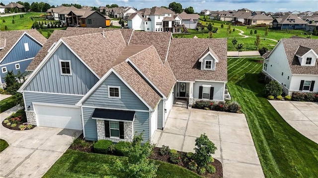 13300 W 174th Pl, Overland Park, KS 66221 - view of front of home featuring a residential view, stone siding, board and batten siding, concrete driveway, and an attached garage