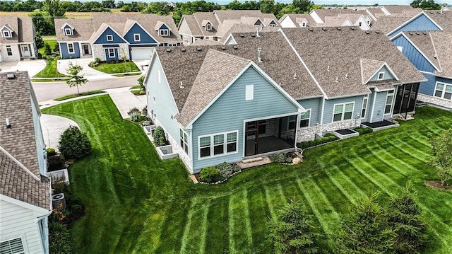 13300 W 174th Pl, Overland Park, KS 66221 - rear view of house with a residential view, a yard, and a shingled roof