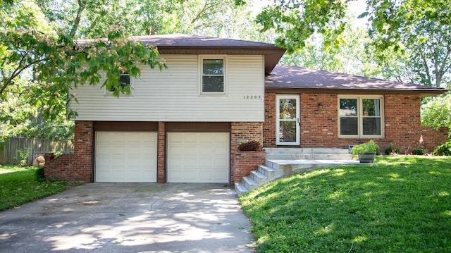12205 W 67th Ter, Shawnee, KS 66216 - split level home featuring an attached garage, brick siding, and concrete driveway