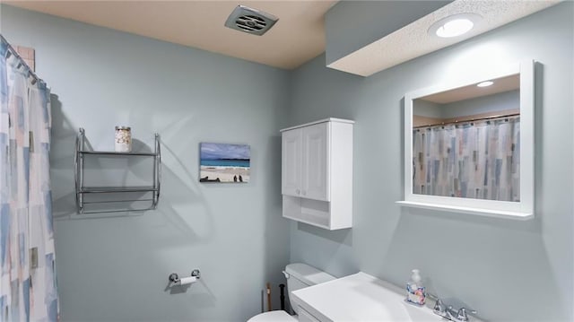 12205 W 67th Ter, Shawnee, KS 66216 - full bath featuring toilet and vanity