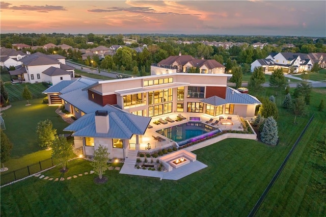 10712 W 165th St, Overland Park, KS 66221 - aerial view at dusk of view of pool area and a residential view