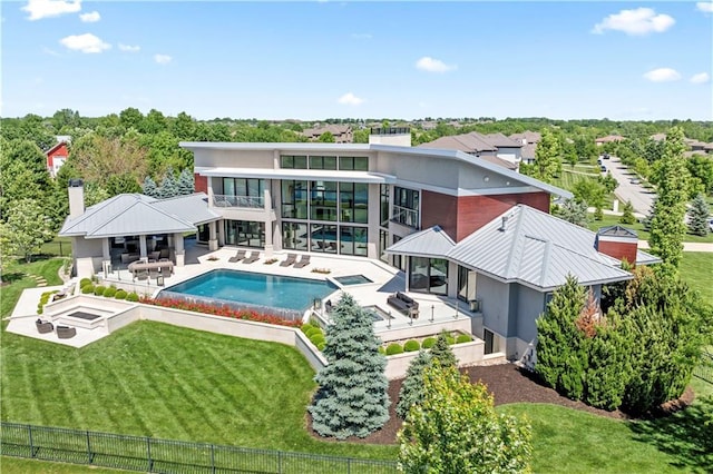10712 W 165th St, Overland Park, KS 66221 - back of property featuring a patio area, a balcony, a chimney, and a pool with connected hot tub