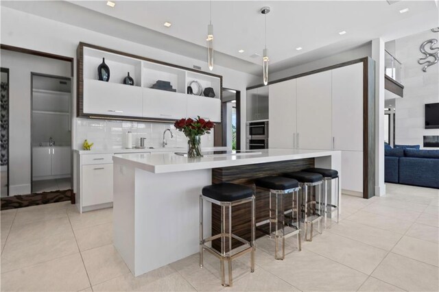 10712 W 165th St, Overland Park, KS 66221 - kitchen with light countertops, light tile patterned floors, oven, white cabinets, and recessed lighting