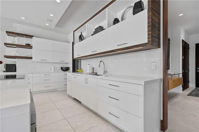 10712 W 165th St, Overland Park, KS 66221 - kitchen with open shelves, light tile patterned floors, light countertops, and white cabinets