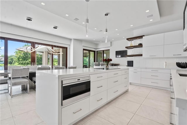 10712 W 165th St, Overland Park, KS 66221 - kitchen with modern cabinets, light tile patterned floors, open shelves, white cabinetry, and light countertops