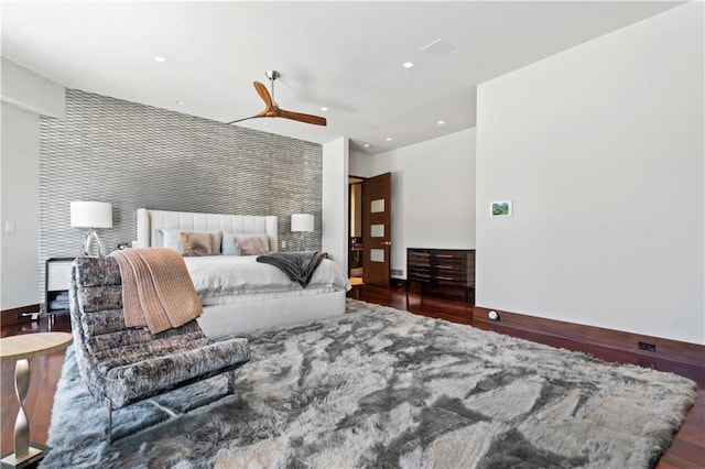 10712 W 165th St, Overland Park, KS 66221 - bedroom featuring an accent wall, wood finished floors, recessed lighting, and a ceiling fan