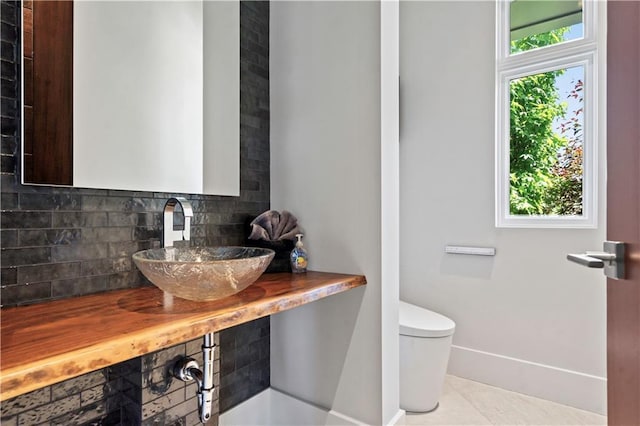 10712 W 165th St, Overland Park, KS 66221 - half bath with decorative backsplash and tile patterned flooring