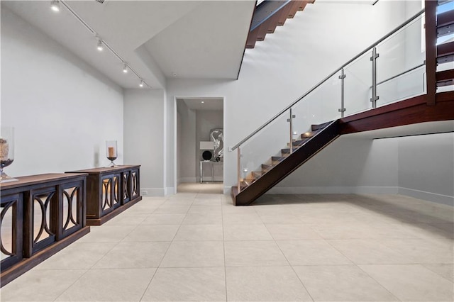 10712 W 165th St, Overland Park, KS 66221 - staircase with track lighting and tile patterned flooring