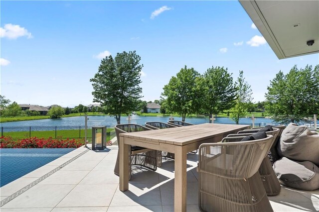 10712 W 165th St, Overland Park, KS 66221 - view of patio / terrace with a water view and outdoor dining area