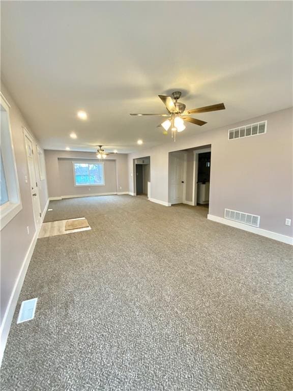 3046 N 27th St, Kansas City, KS 66104 - unfurnished living room with ceiling fan, carpet floors, and recessed lighting
