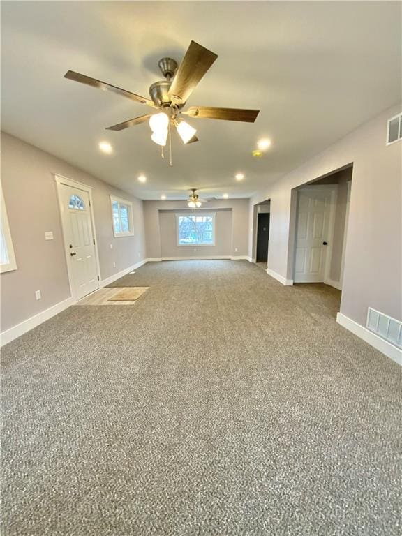 3046 N 27th St, Kansas City, KS 66104 - unfurnished living room featuring a ceiling fan, recessed lighting, and carpet flooring