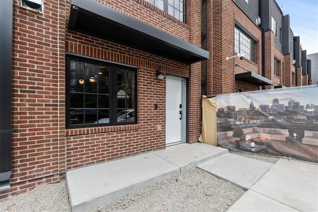 529 E 19th St, Kansas City, MO 64108 - view of exterior entry with brick siding