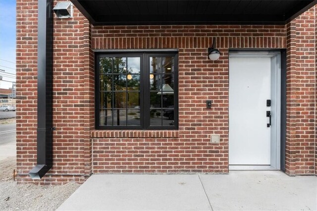 529 E 19th St, Kansas City, MO 64108 - view of exterior entry with brick siding