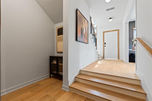 529 E 19th St, Kansas City, MO 64108 - staircase with wood finished floors and baseboards