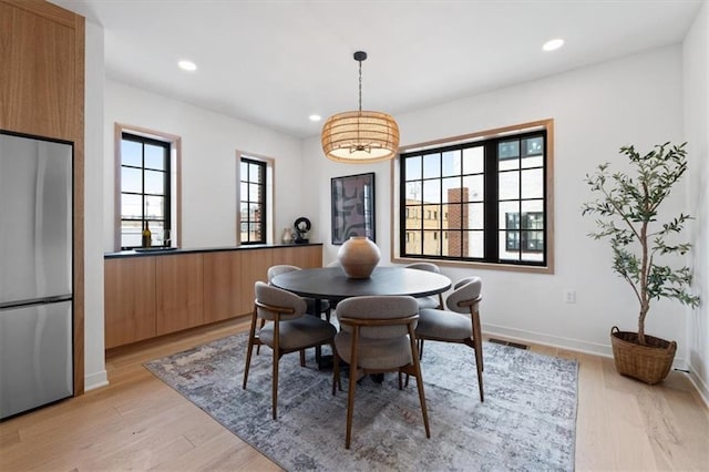 529 E 19th St, Kansas City, MO 64108 - dining area with light wood-style floors and recessed lighting