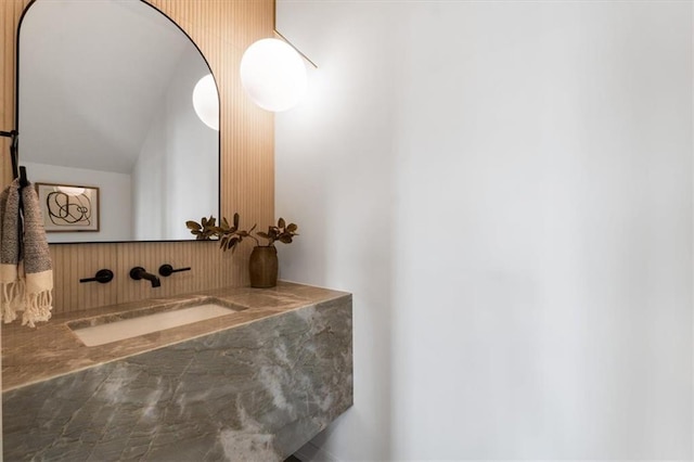 529 E 19th St, Kansas City, MO 64108 - bathroom featuring lofted ceiling and vanity