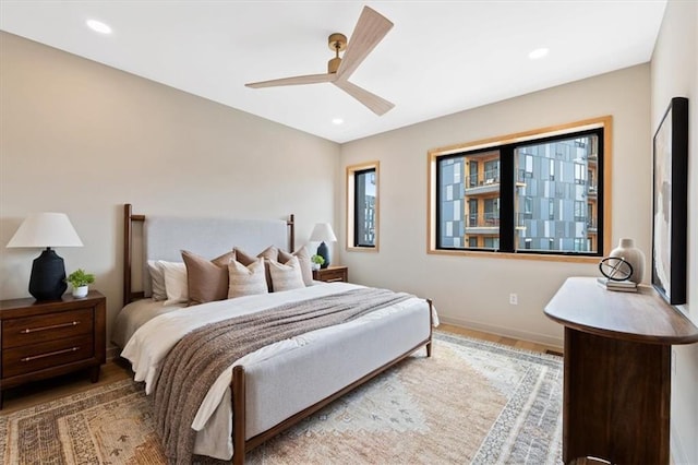529 E 19th St, Kansas City, MO 64108 - bedroom featuring wood finished floors, recessed lighting, and a ceiling fan