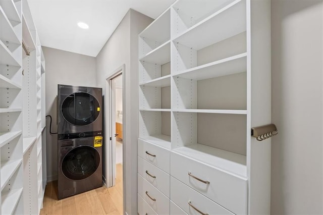 529 E 19th St, Kansas City, MO 64108 - laundry area featuring estacked washer and dryer and light wood-type flooring