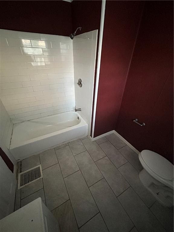 907 S Cedar Ave, Independence, MO 64052 - bathroom with shower / bath combination and tile patterned flooring