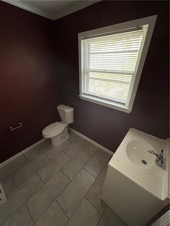 907 S Cedar Ave, Independence, MO 64052 - bathroom with crown molding, tile patterned floors, and vanity
