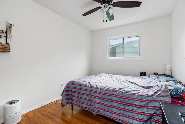 255 N Michigan St Unit 90, Lawrence, KS 66044 - bedroom with wood finished floors and ceiling fan