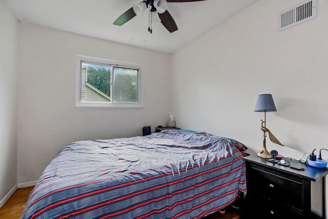 255 N Michigan St Unit 90, Lawrence, KS 66044 - bedroom with wood finished floors and a ceiling fan
