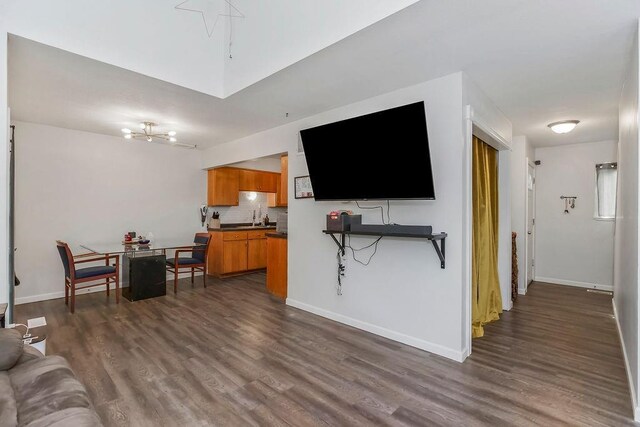 255 N Michigan St Unit 90, Lawrence, KS 66044 - living room with dark wood finished floors and a chandelier
